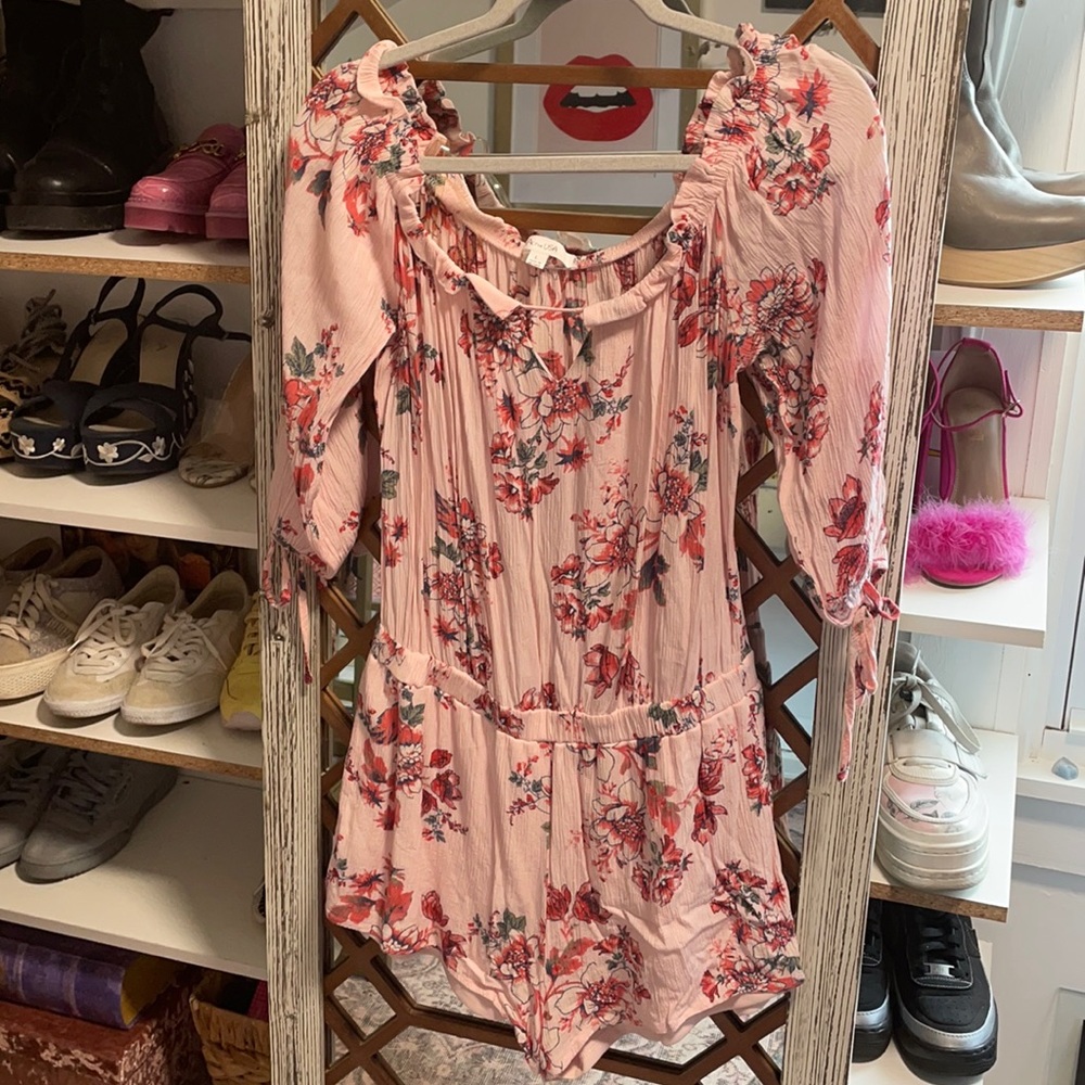 Floral printed quarter sleeve romper.